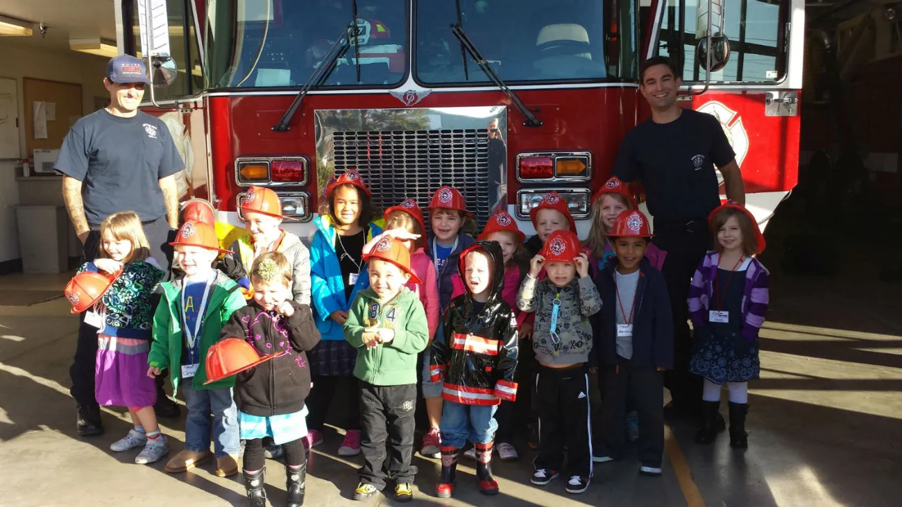 Preschool class visiting with local firefighters