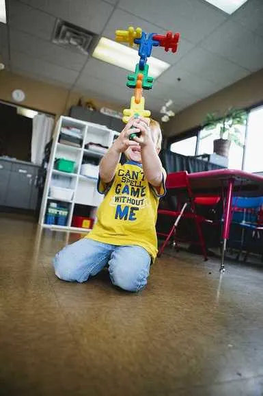 Preschool children playing and exploring in class