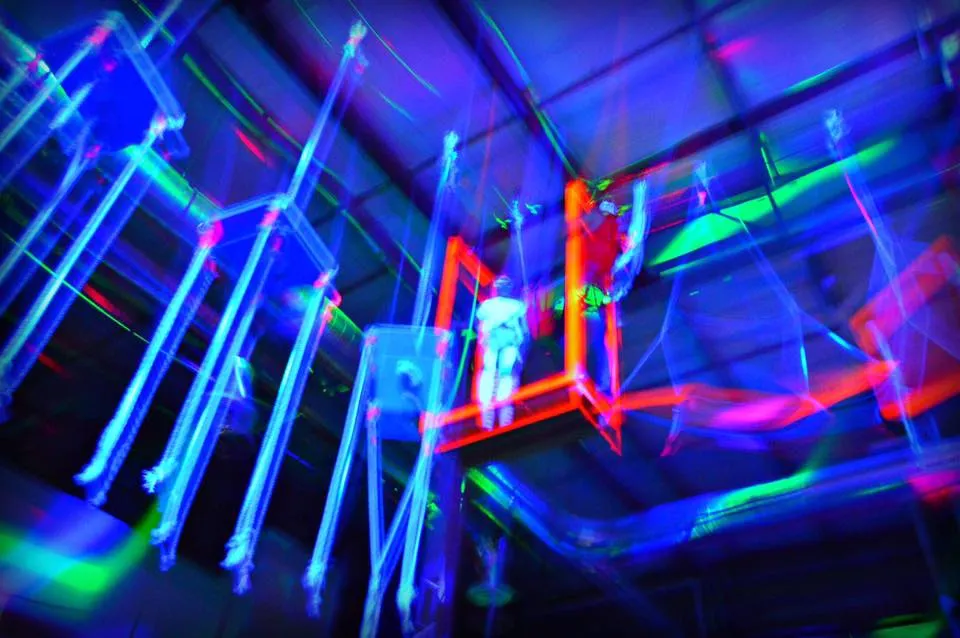 Kids and adults high on the ropes course walkways