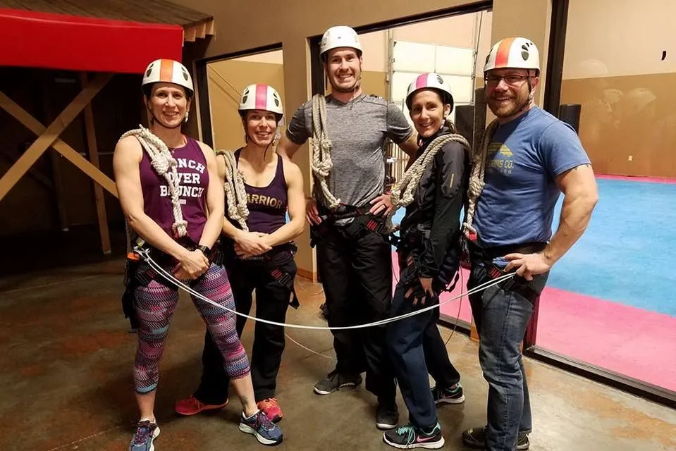 Harness and safety locks ready for the high ropes course