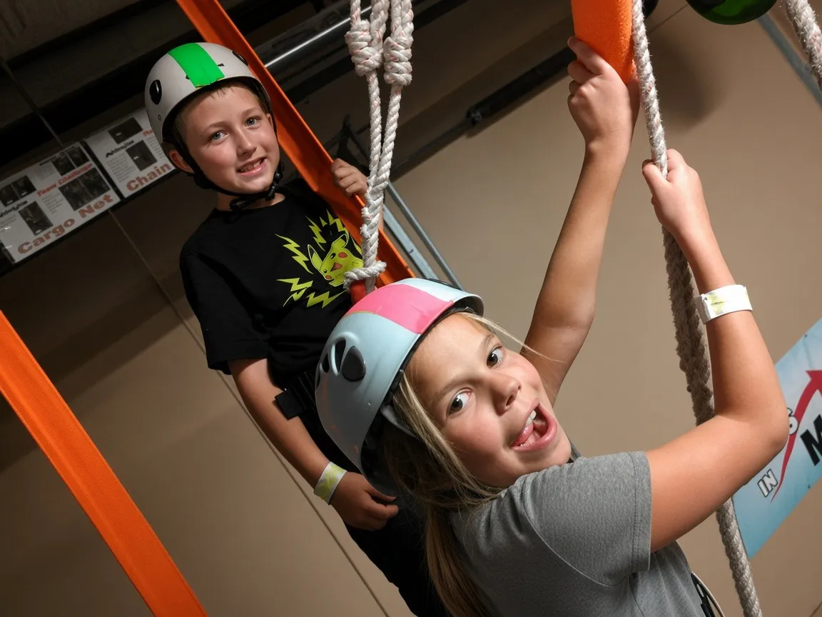 Birthday guests in helmets on the ropes course add-on